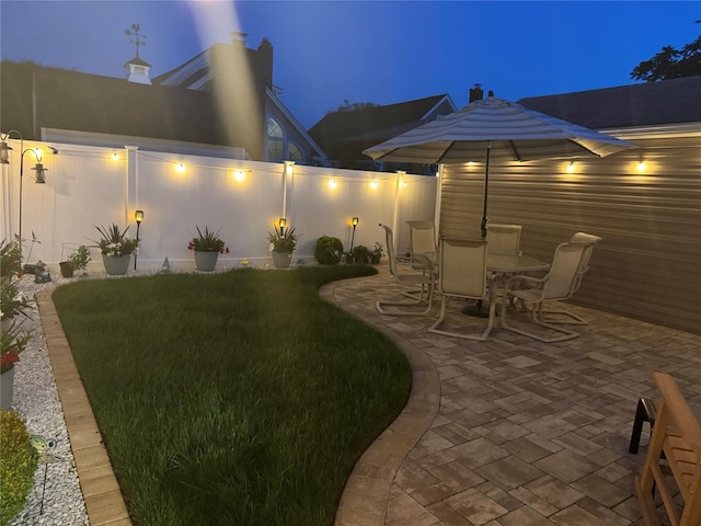 115 W Granada Ave, Lindenhurst, NY 11757 - yard at twilight with a patio area, a lawn, and outdoor dining area