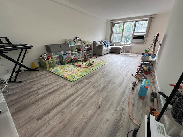 209-15 18th Ave Unit 2A, Bayside, NY 11360 - living area with wood finished floors and cooling unit