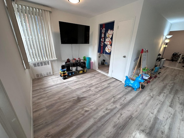 209-15 18th Ave Unit 2A, Bayside, NY 11360 - living room featuring wood finished floors and radiator heating unit