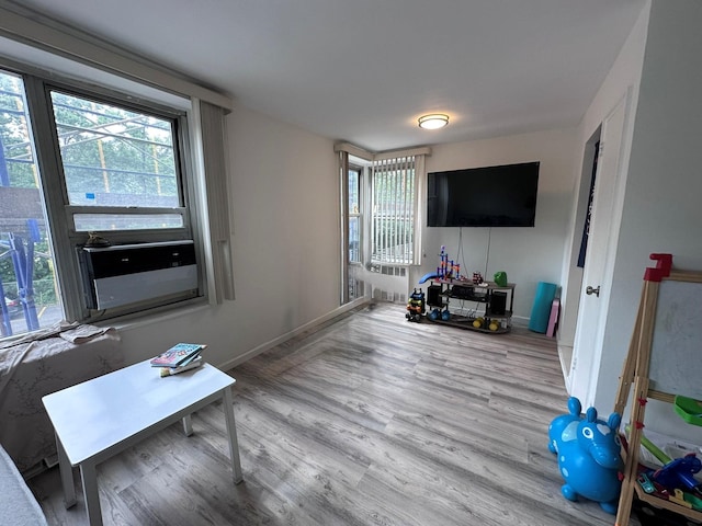 209-15 18th Ave Unit 2A, Bayside, NY 11360 - living room with wood finished floors, plenty of natural light, and cooling unit