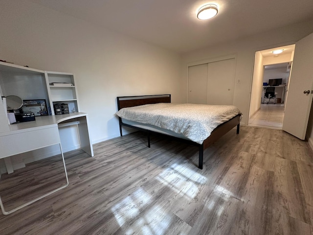 209-15 18th Ave Unit 2A, Bayside, NY 11360 - bedroom featuring wood finished floors, a closet, and an office area