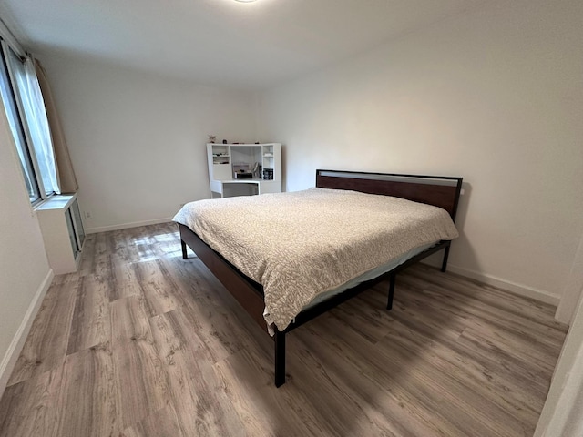 209-15 18th Ave Unit 2A, Bayside, NY 11360 - bedroom with wood finished floors and baseboards