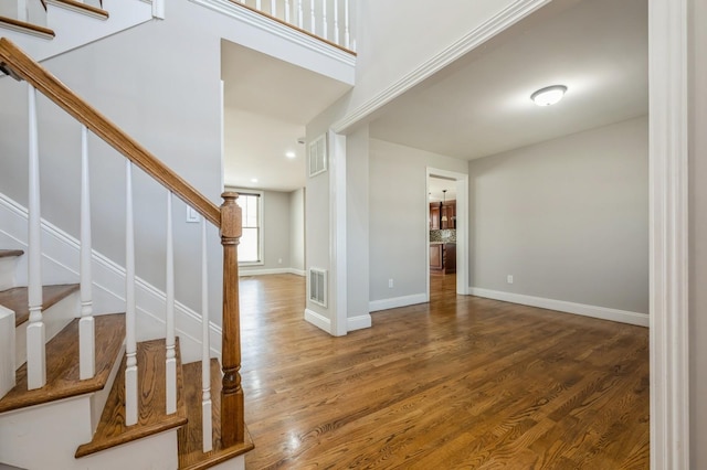 413 Robyn Pl, East Meadow, NY 11554 - foyer with stairs, wood finished floors, and recessed lighting