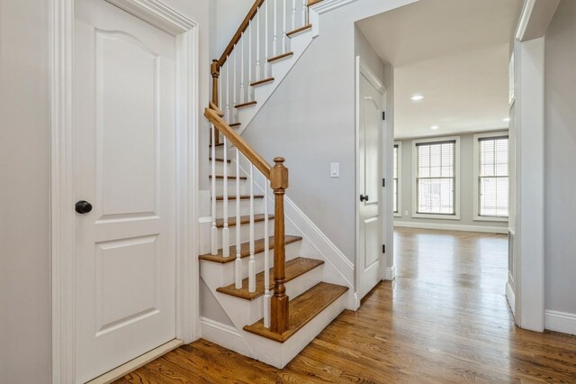 413 Robyn Pl, East Meadow, NY 11554 - staircase with wood finished floors and recessed lighting