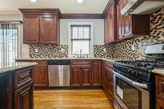 413 Robyn Pl, East Meadow, NY 11554 - kitchen with appliances with stainless steel finishes, ventilation hood, light stone countertops, light wood-type flooring, and recessed lighting