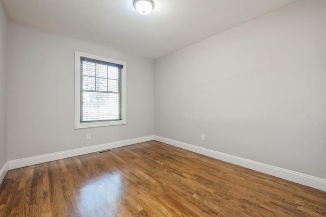 413 Robyn Pl, East Meadow, NY 11554 - spare room featuring baseboards and wood finished floors