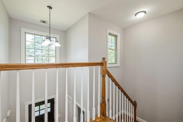 413 Robyn Pl, East Meadow, NY 11554 - stairs with a chandelier and wood finished floors