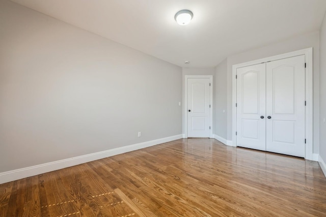 413 Robyn Pl, East Meadow, NY 11554 - unfurnished bedroom featuring wood finished floors and a closet