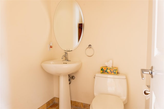 600 Clarence Ave Unit 2H, Bronx, NY 10465 - half bath featuring toilet and baseboards