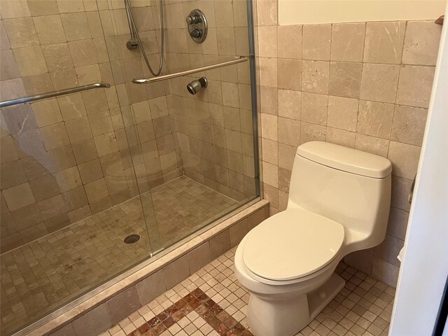 600 Clarence Ave Unit 2H, Bronx, NY 10465 - bathroom featuring a stall shower, tile walls, and tile patterned floors