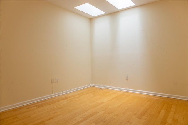 600 Clarence Ave Unit 2H, Bronx, NY 10465 - empty room featuring a skylight and light wood-style floors