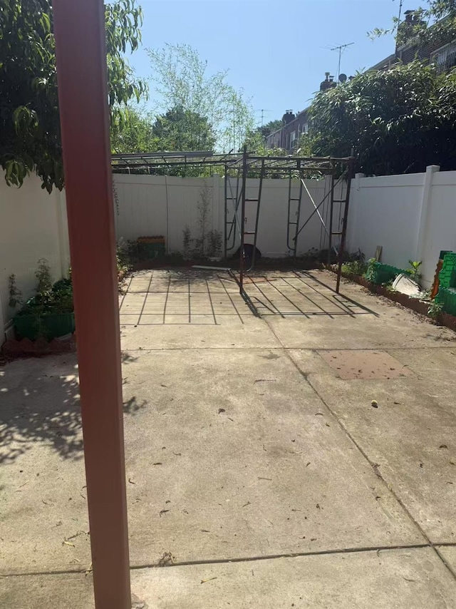 58-13 150th St, Flushing, NY 11355 - fenced backyard featuring a patio area