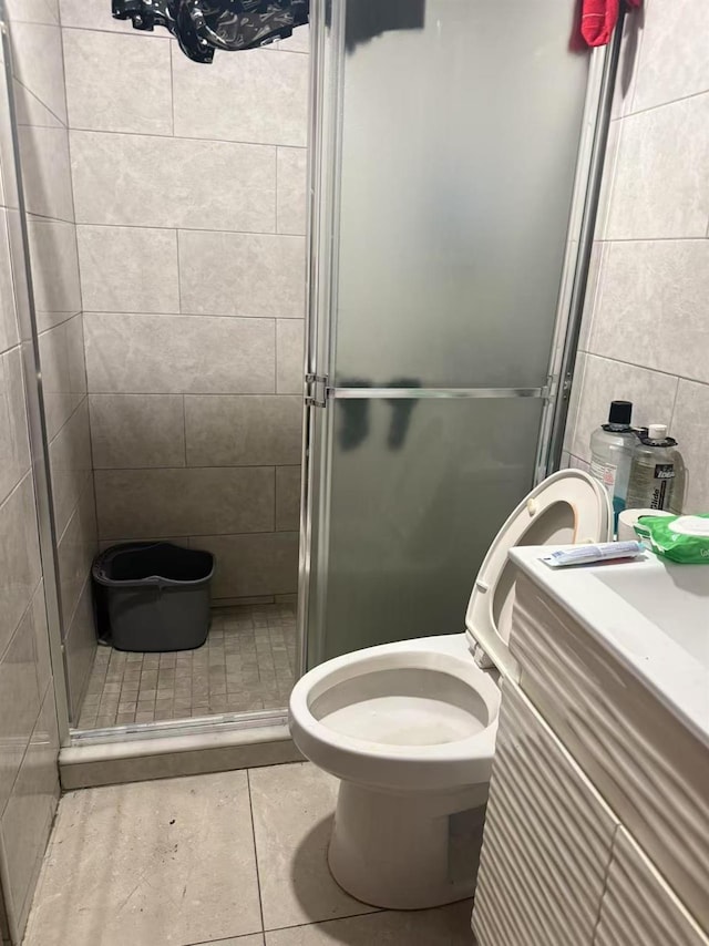 58-13 150th St, Flushing, NY 11355 - full bathroom featuring a stall shower, tile patterned flooring, vanity, and tile walls