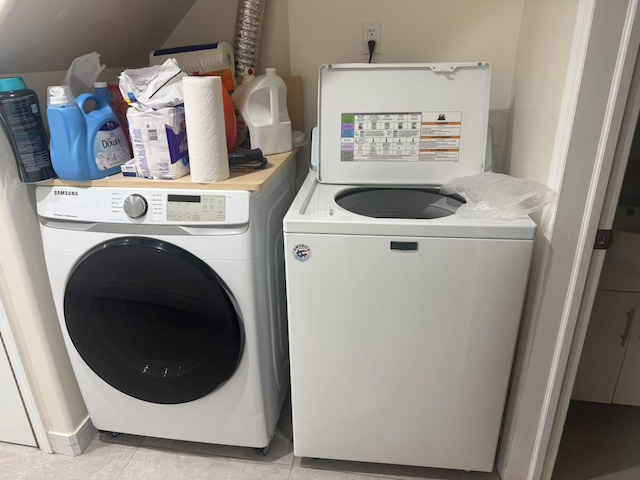 58-13 150th St, Flushing, NY 11355 - washroom with washing machine and clothes dryer and light tile patterned floors
