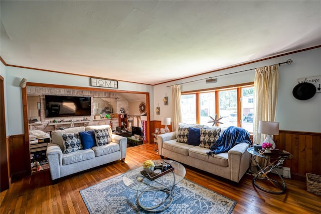 805 Arlington Rd, West Babylon, NY 11704 - living room with a wainscoted wall, wooden walls, ornamental molding, and hardwood / wood-style floors
