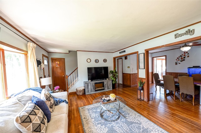 805 Arlington Rd, West Babylon, NY 11704 - living area with plenty of natural light, stairs, wood-type flooring, crown molding, and ceiling fan