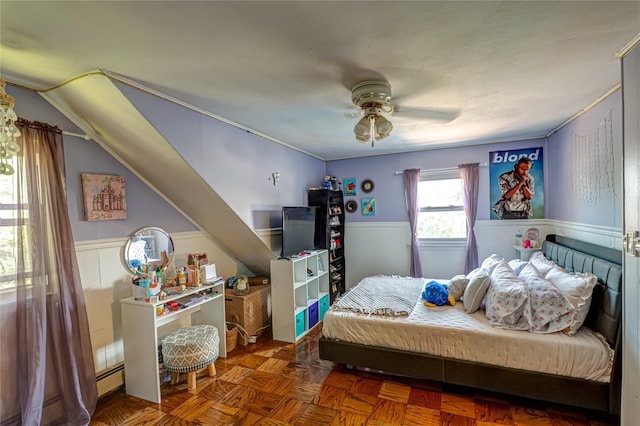 805 Arlington Rd, West Babylon, NY 11704 - bedroom featuring a wainscoted wall, baseboard heating, and ceiling fan