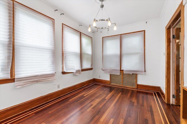 345 Broadway, Lawrence, NY 11559 - unfurnished dining area with a chandelier and wood finished floors