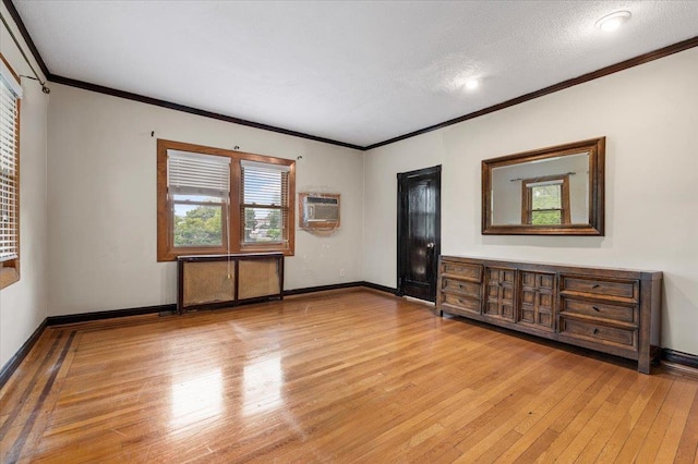 345 Broadway, Lawrence, NY 11559 - spare room featuring light wood finished floors, a wall unit AC, and crown molding