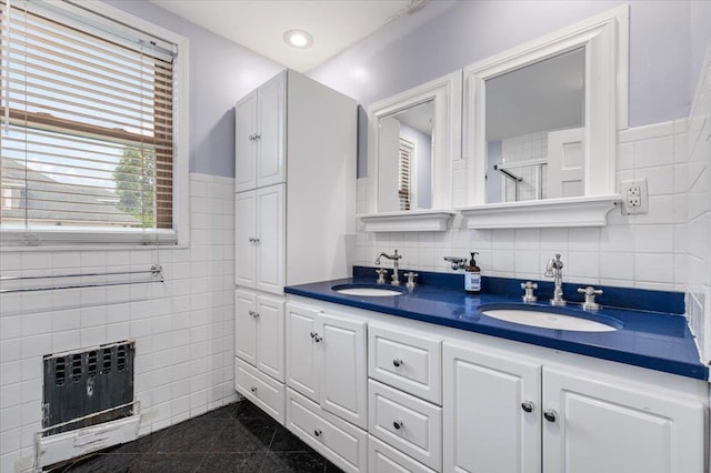 345 Broadway, Lawrence, NY 11559 - full bathroom with tile walls, double vanity, wainscoting, granite floors, and a shower