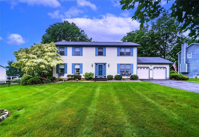 25 Briarwood Dr, Wappingers Falls, NY 12590 - colonial inspired home with asphalt driveway and a garage