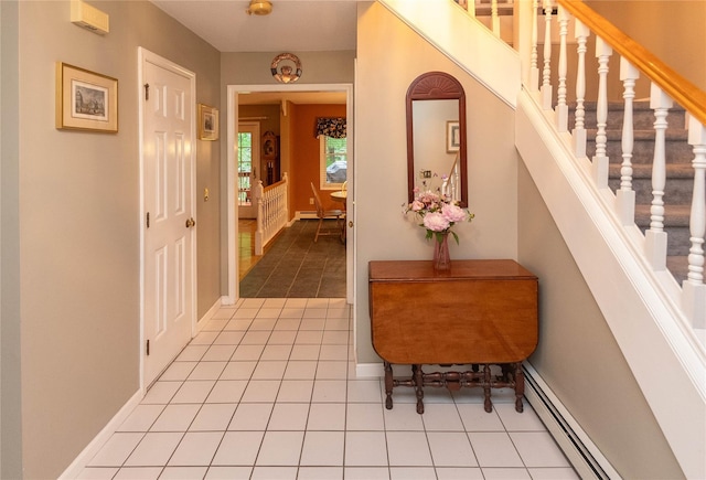25 Briarwood Dr, Wappingers Falls, NY 12590 - hallway featuring a baseboard radiator, tile patterned flooring, and stairs