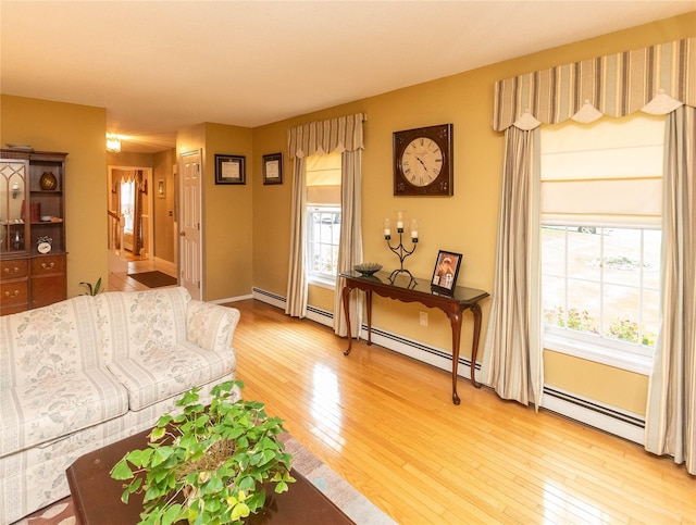 25 Briarwood Dr, Wappingers Falls, NY 12590 - living area featuring light wood-style flooring and a baseboard heating unit