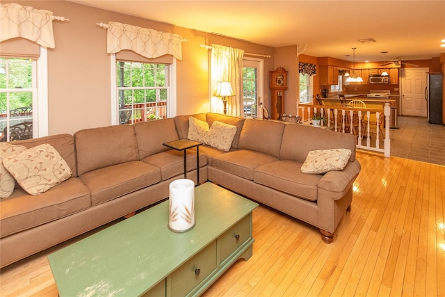 25 Briarwood Dr, Wappingers Falls, NY 12590 - living area with plenty of natural light and light wood-style flooring
