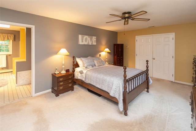 25 Briarwood Dr, Wappingers Falls, NY 12590 - bedroom featuring light colored carpet, ensuite bathroom, a ceiling fan, and a baseboard heating unit