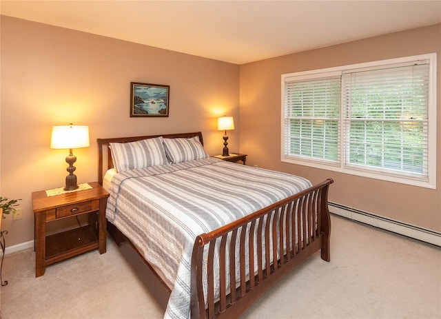25 Briarwood Dr, Wappingers Falls, NY 12590 - bedroom with light carpet and a baseboard heating unit