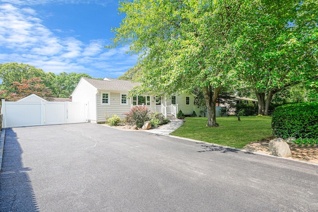 14 Sycamore St, Centereach, NY 11720 - view of front facade with a gate and driveway