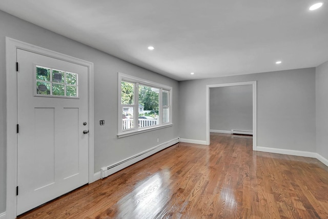14 Sycamore St, Centereach, NY 11720 - foyer entrance with a baseboard radiator, wood finished floors, recessed lighting, and baseboard heating