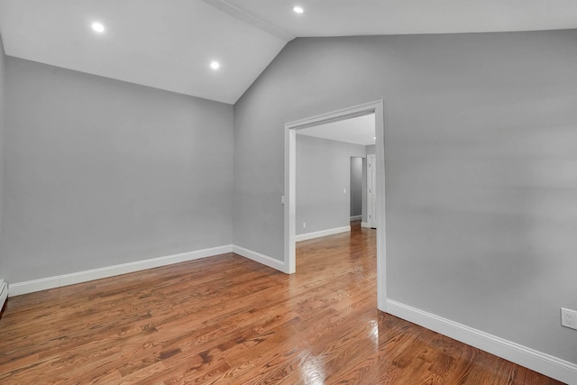 14 Sycamore St, Centereach, NY 11720 - empty room with lofted ceiling, wood finished floors, and recessed lighting