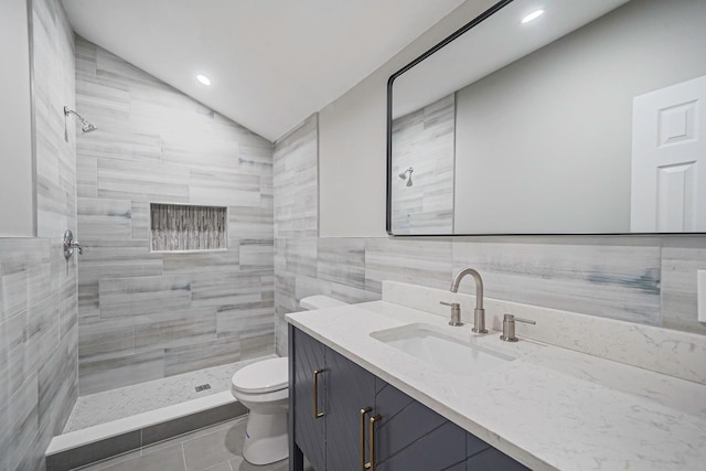 14 Sycamore St, Centereach, NY 11720 - full bathroom with tiled shower, vanity, lofted ceiling, tile walls, and tile patterned flooring