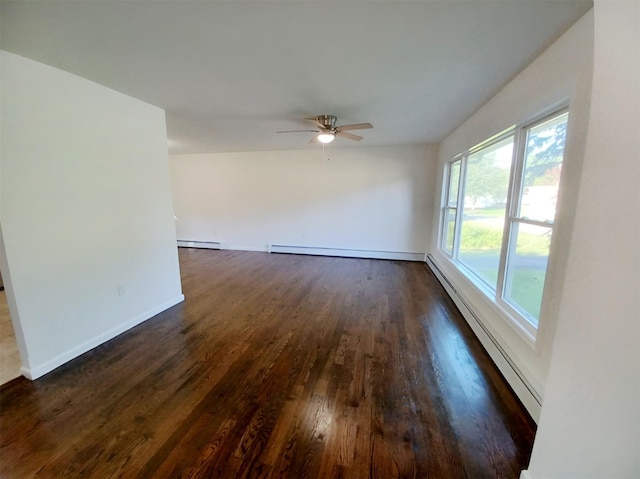 14 Laddie Rd, Middletown, NY 10941 - empty room with dark wood finished floors, a ceiling fan, and a baseboard heating unit