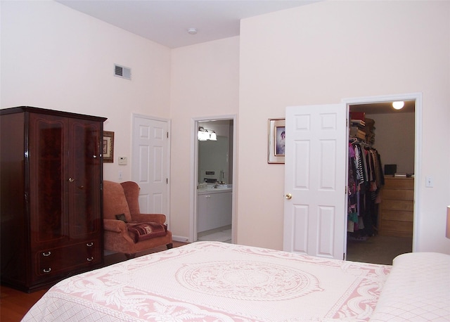 8 Long House Way, Commack, NY 11725 - bedroom with a walk in closet, a towering ceiling, a closet, and connected bathroom