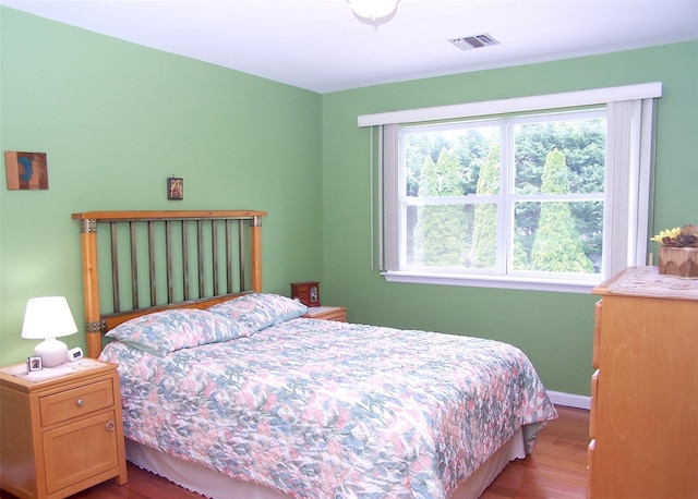 8 Long House Way, Commack, NY 11725 - bedroom with wood finished floors and baseboards