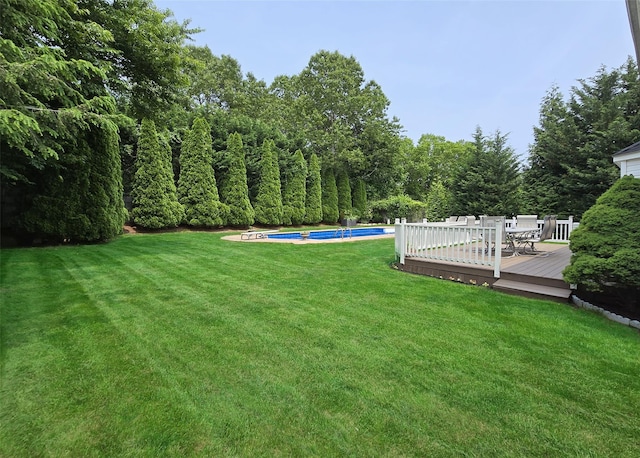 8 Long House Way, Commack, NY 11725 - view of grassy yard with a deck and an outdoor pool