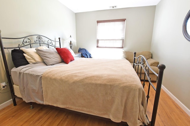 310 Fairview Cir, Middle Island, NY 11953 - bedroom featuring baseboards and wood finished floors