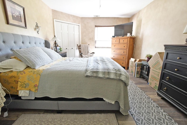 310 Fairview Cir, Middle Island, NY 11953 - bedroom with a closet and wood finished floors