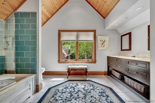218 Kuhne Rd, Call Listing Agent, CT 06488 - full bath featuring vaulted ceiling, wooden ceiling, vanity, a bath, and tile patterned floors