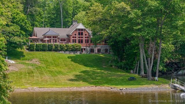 218 Kuhne Rd, Call Listing Agent, CT 06488 - view from above of property with a large body of water and a heavily wooded area