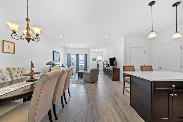105 Captain S Way, Copiague, NY 11726 - dining space featuring a chandelier, light wood-style floors, and recessed lighting