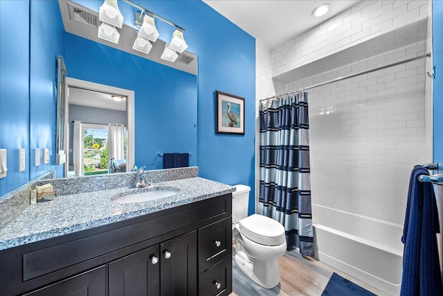 105 Captain S Way, Copiague, NY 11726 - full bathroom featuring vanity, wood finished floors, and shower / tub combo