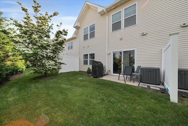 105 Captain S Way, Copiague, NY 11726 - back of property featuring a patio and a lawn