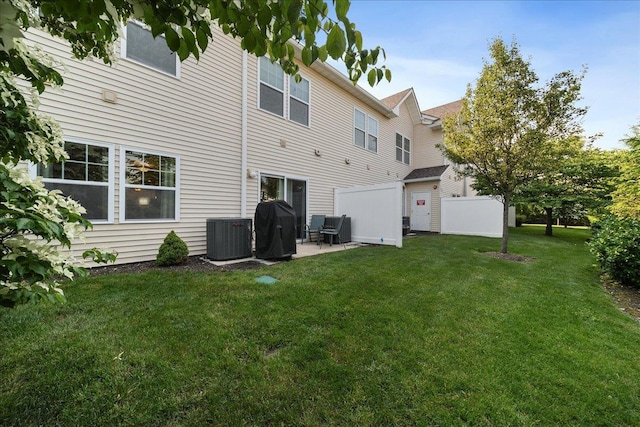 105 Captain S Way, Copiague, NY 11726 - rear view of property with a patio area