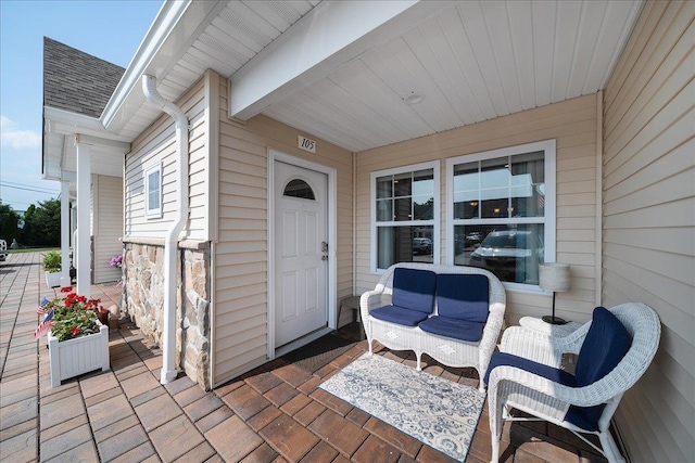 105 Captain S Way, Copiague, NY 11726 - property entrance featuring roof with shingles