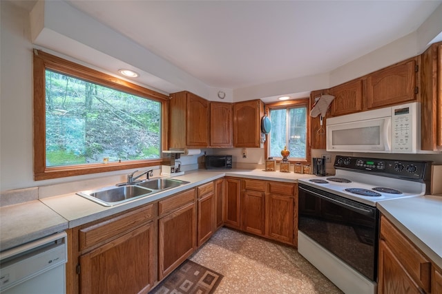 442 Main St, Grahamsville, NY 12740 - kitchen featuring white appliances, light countertops, and healthy amount of natural light