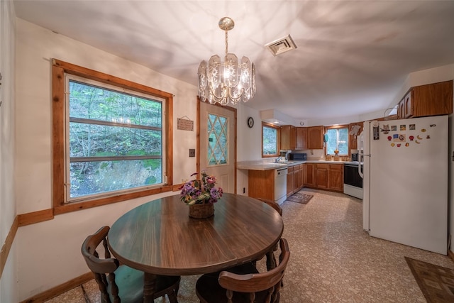 442 Main St, Grahamsville, NY 12740 - dining area featuring a chandelier and baseboards