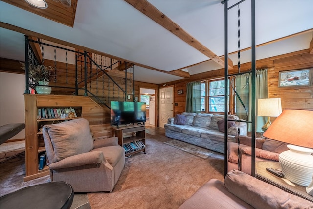 442 Main St, Grahamsville, NY 12740 - living room featuring wood walls, carpet, stairway, and beamed ceiling